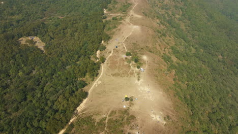 High-altitude-drone-shot-of-green-hills-and-forests-in-a-Chinese-national-park