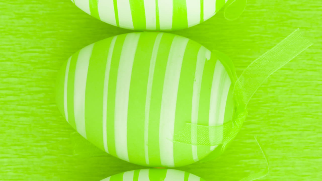 Animation of easter eggs on green background