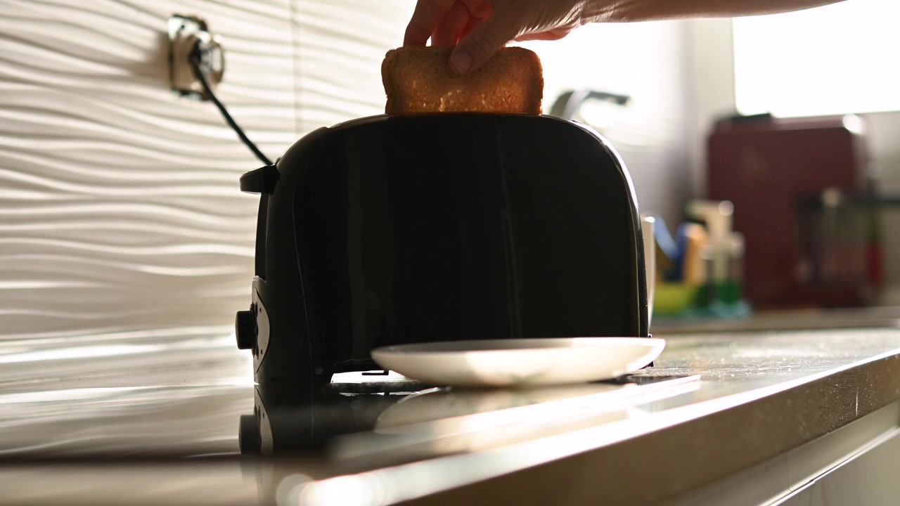 Preparing Toast for Breakfast in Modern Kitchen