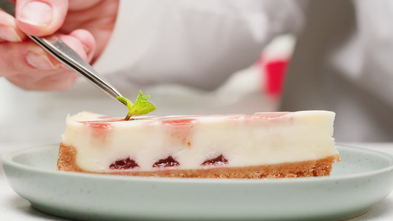 Chef Preparing a Slice of Strawberry Cheesecake