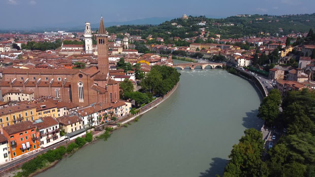 Cinematic drone view over picture perfect Italian streets, River Adige and Ponte Pietra in Verona, Italy