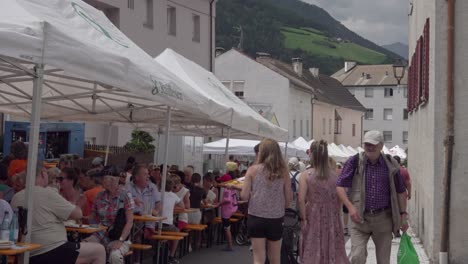 marble and apricot festival - visitors and stands on the main street, laas - lasa, south tyrol, italy (part 2 of 2)