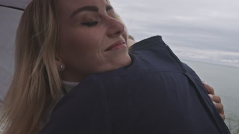 couple by the sea on a cloudy day