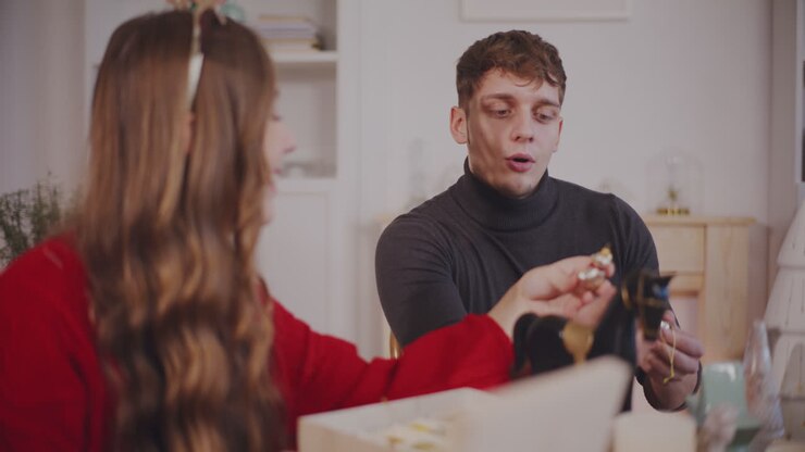 Friends talking to each other at home on Christmas