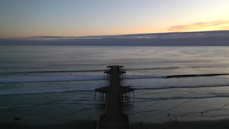 aerial revealed pismo beach pier in california, the united states during sunset