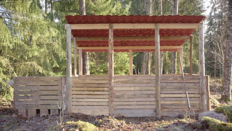 wide empty shot of a 3 bay pallet wood compost building, homemade