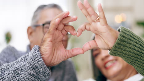 senior couple, heart hands