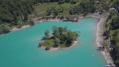 beautiful blue lake called lago di tenno on a sunny summer day in europe, north italy