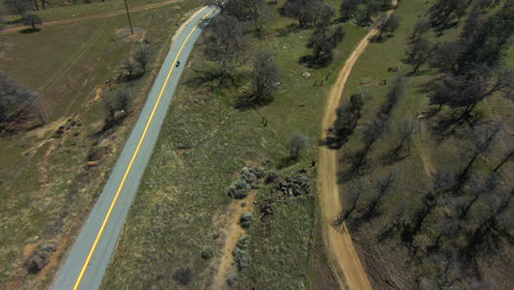 A-lone-motorcyclist-rides-on-a-dreamy-day-through-the-Tehachapi-Mountains-on-a-scenic-winding-road-with-no-one-else-around