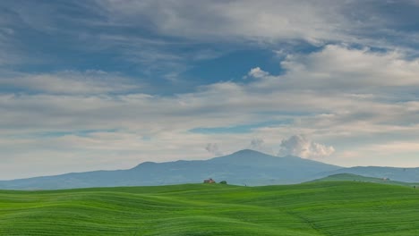 landscape in tuscany with green fields and hills, time-lapse 4k video