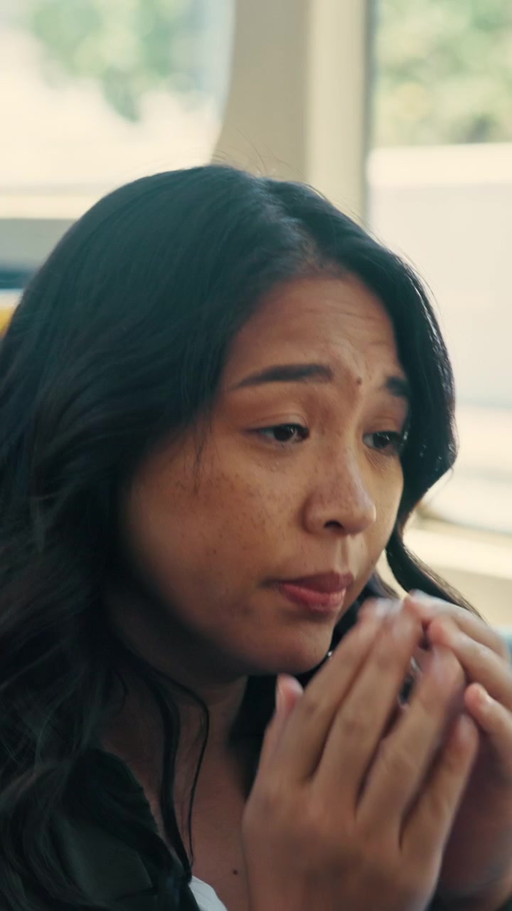 Upset Woman Crying and Covering Her Face While Riding Public Transit