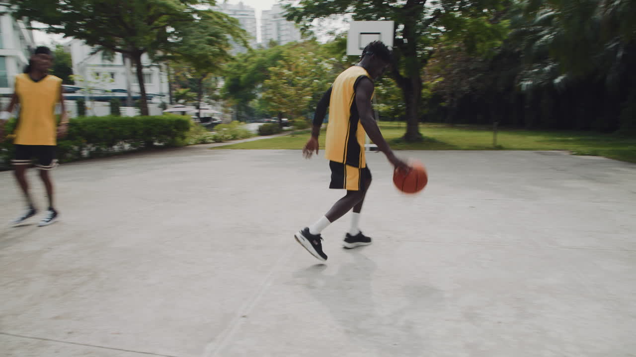 Active Friends Playing Streetball Outdoors