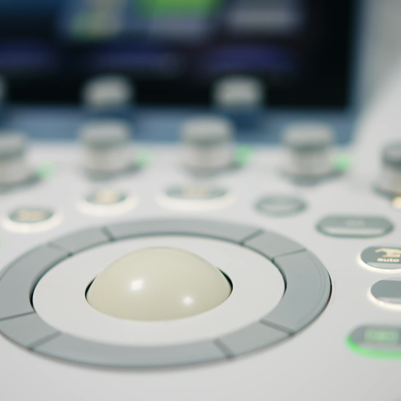 Switched on touch screen of the sonographic equipment in modern clinics. Set of diverse keys and buttons close up. Blurred backdrop