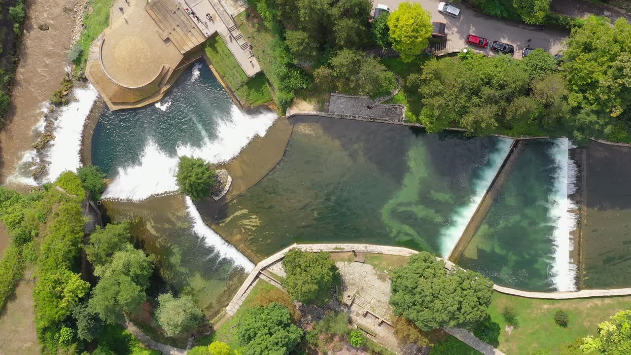 Jajce Waterfall in Bosnia and Herzegovina from above with stepping stream, Aerial top view close in shot