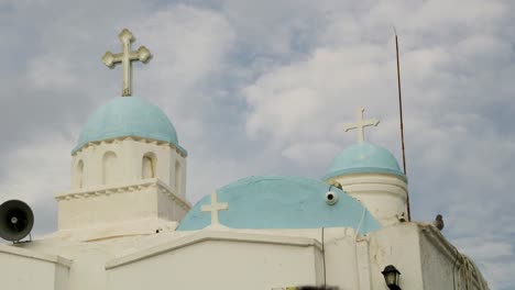 greek church domes under cloudy sky