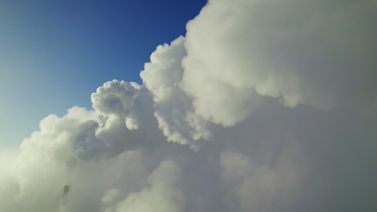 Fluffy Cumulus Clouds Against a Blue Sky