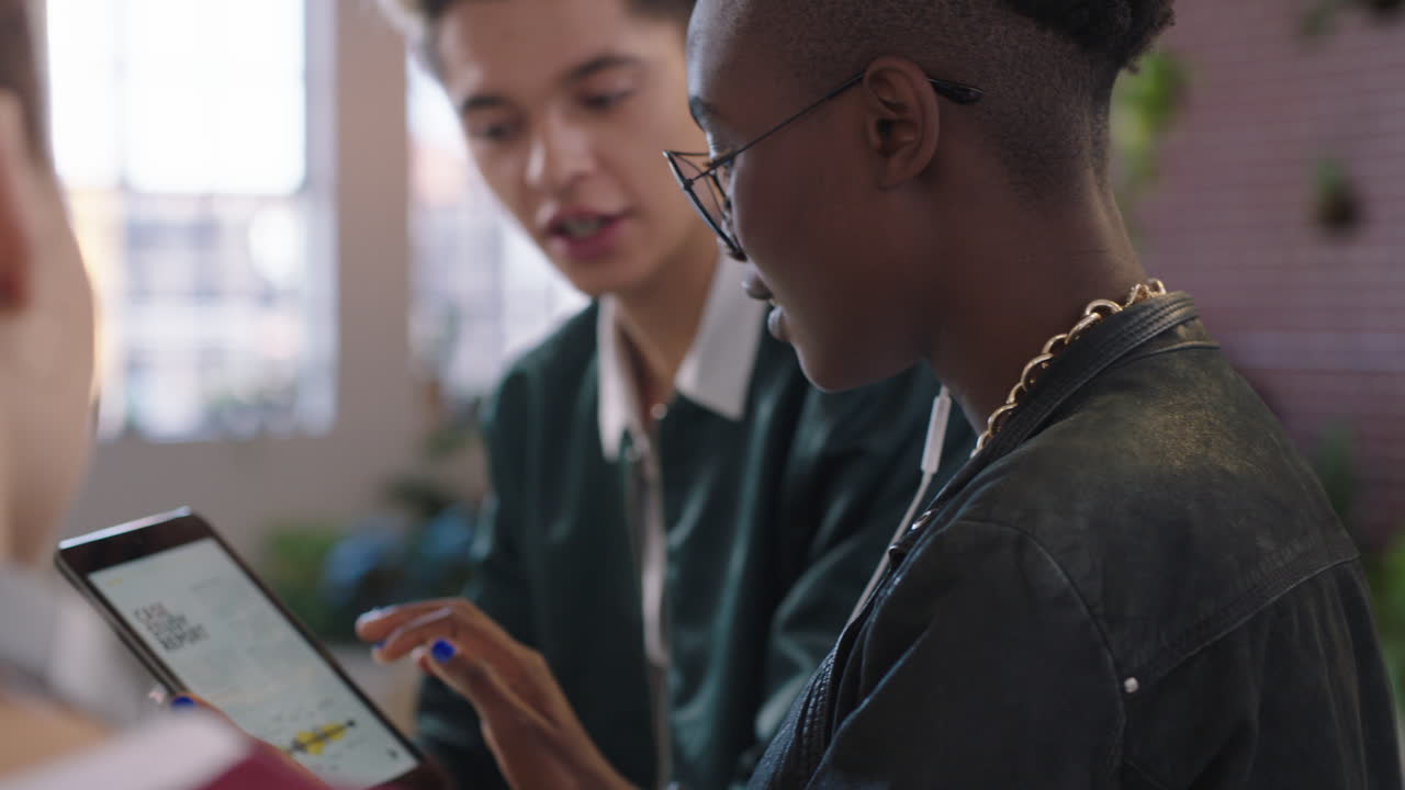young business people brainstorming african american team leader woman sharing ideas using digital tablet computer training students enjoying teamwork in diverse trendy office workplace