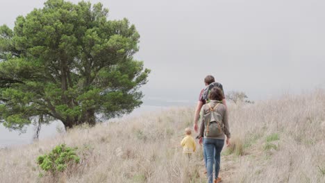 Caucasian-family-walking-in-forest