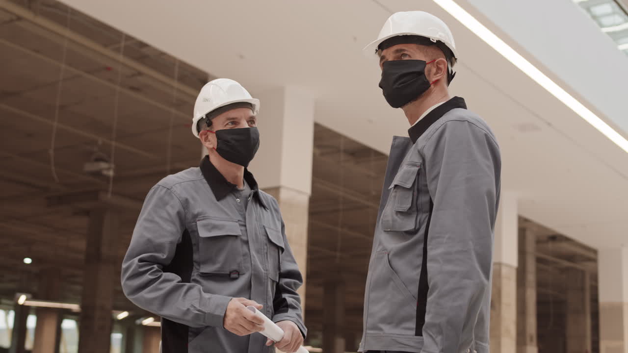 Builders Bumping Elbows Before Work