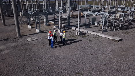 electrical substation workers inspecting equipment
