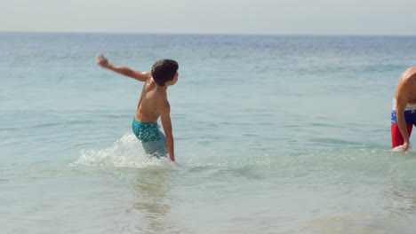 Father-and-son-having-fun-with-waves