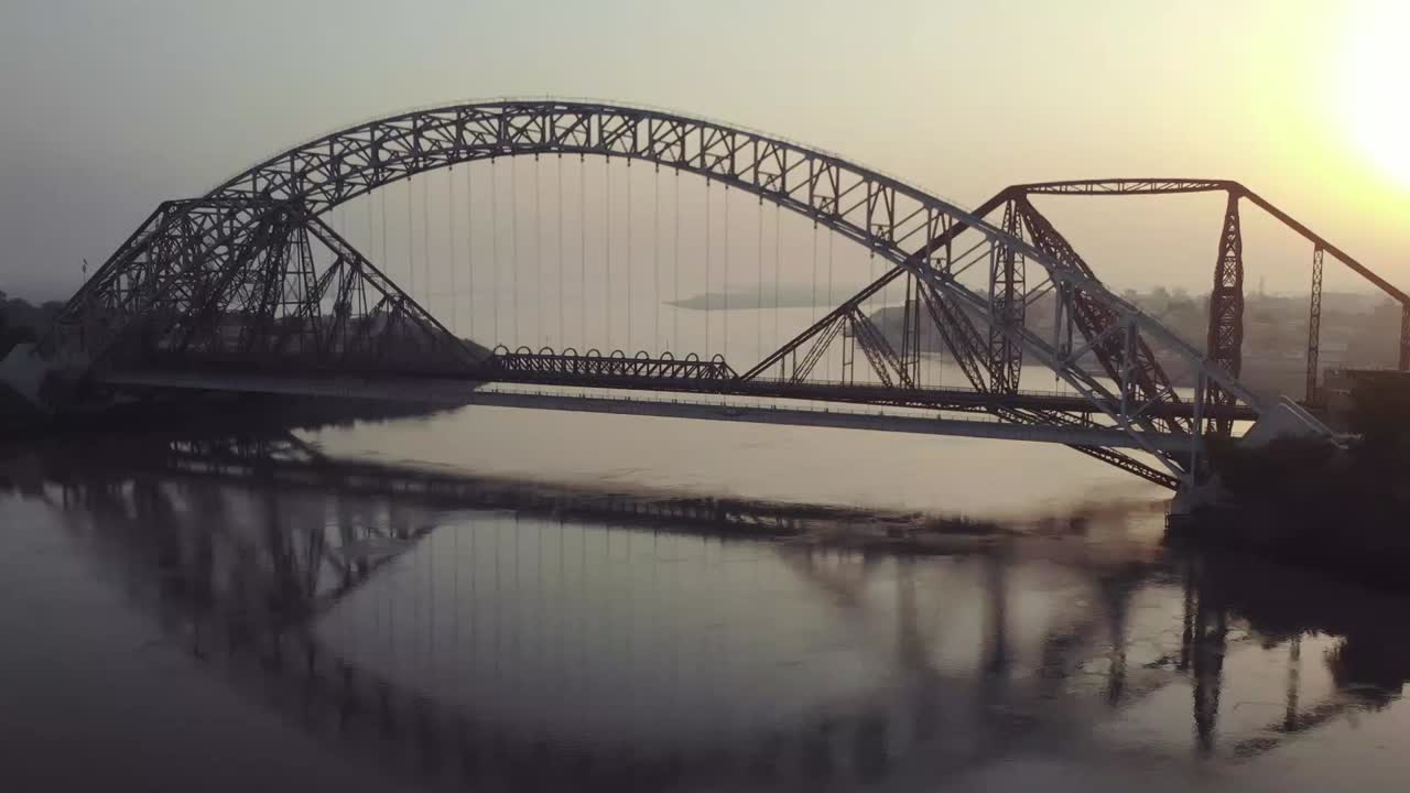 Aerial Of Lansdowne And Ayub Bridge Over Indus River During Evening Light. Follow Shot