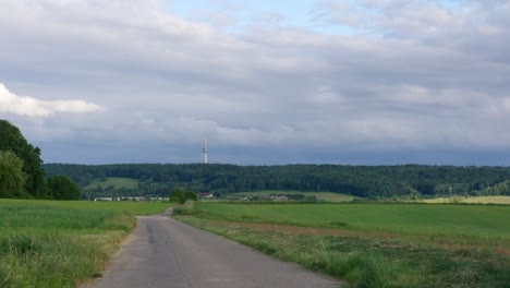 timelapse of cloudy skies above rural farm field outside of stuttgart in afternoon, baden wurttemberg, germany, europe