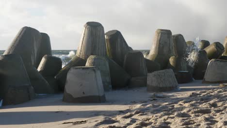 slow motion shot of the tetrapods protecting the shore from the waves at the beach of hörnum located at the island of sylt