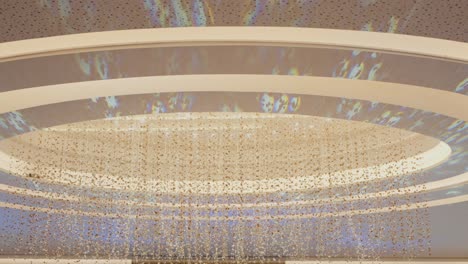 large ceiling light fixture with thousands of mini leds in a circular pattern