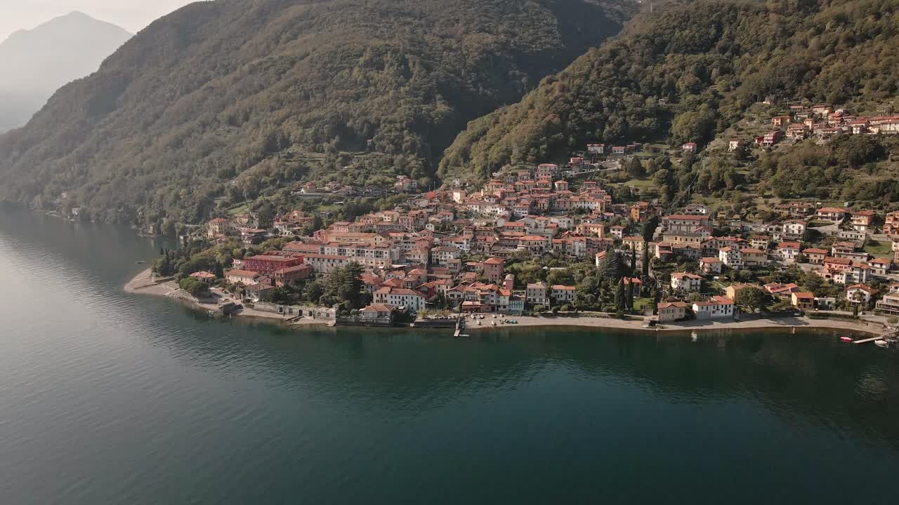 Stunning aerial drone footage of Acquaseria, a charming Italian lakeside town on Lake Como. The video showcases its beauty with smooth left-to-right movement, perfect for travel or lifestyle projects.