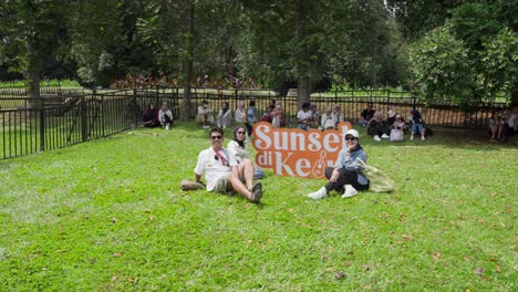 indonesians gather for a memorable outdoor concert at sunset in kebun