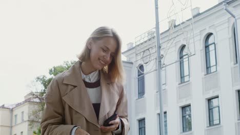 young woman using smartphone in city