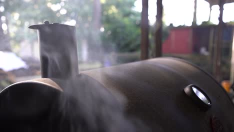 Close-up-of-smoking-backyard-barbeque-cooking-a-delicious-authentic-American-meal