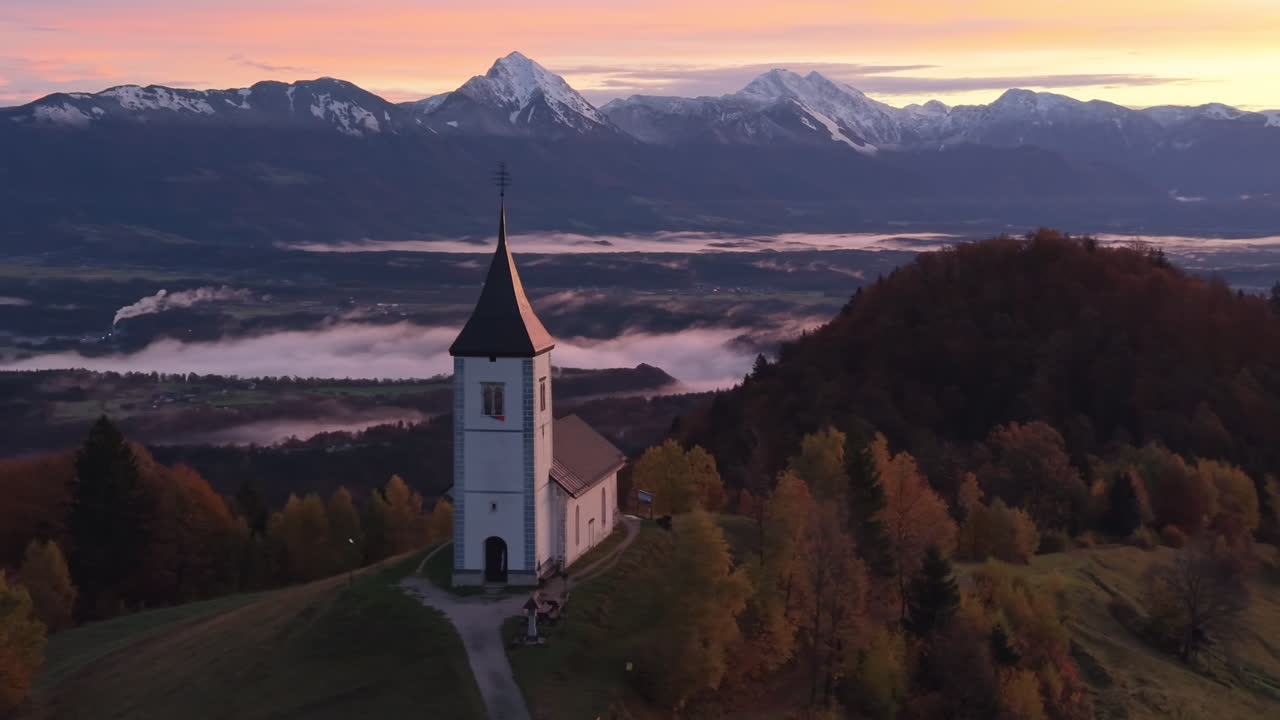 Jamnik church in Slovenia aerial view during sunrise