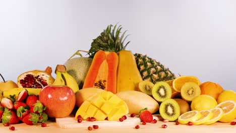 assorted fruits beautifully arranged on white background