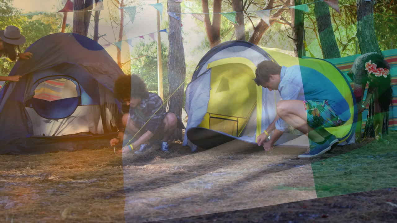 People setting up tents in forest with colorful animation overlay