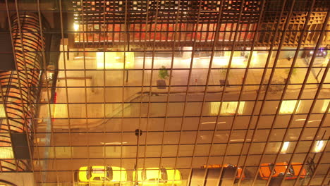 lights reflected in mirrored hotel building