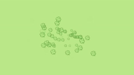 animation of multiple moving clover over green background