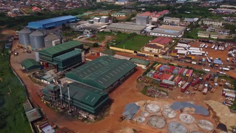 high angle view of factories and warehouses on an industrial zone in nigeria, africa. raw material producing company in nigeria, africa.