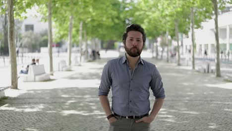 Bearded-man-talking-at-camera-outdoor