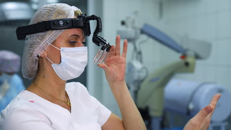doctor preparing for eye surgery. portrait view of female doctor preeparing for eye surgery