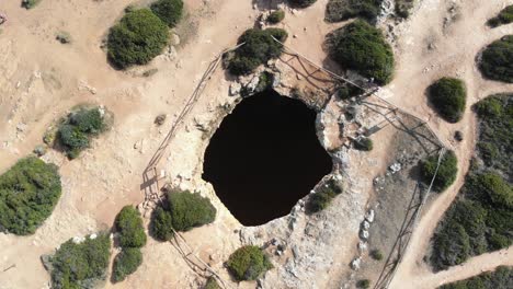 algar de benagil secret cave, outside hole - rocket reveal aerial shot