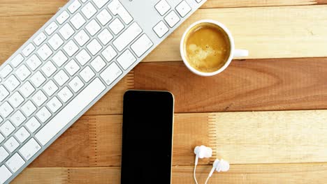 keyboard with mobile phone and cup of coffee