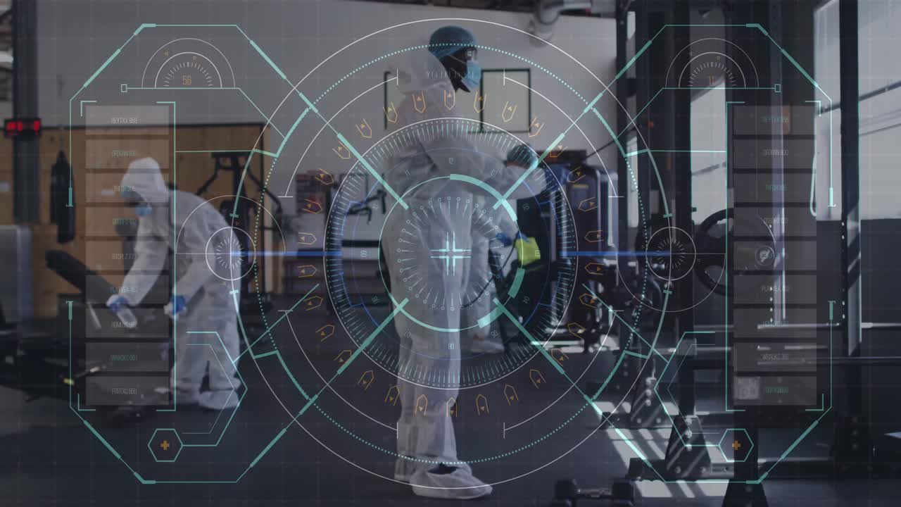 디지털 인터페이스와 헬스 워커 팀이 체육관에서 소독제를 분사합니다.