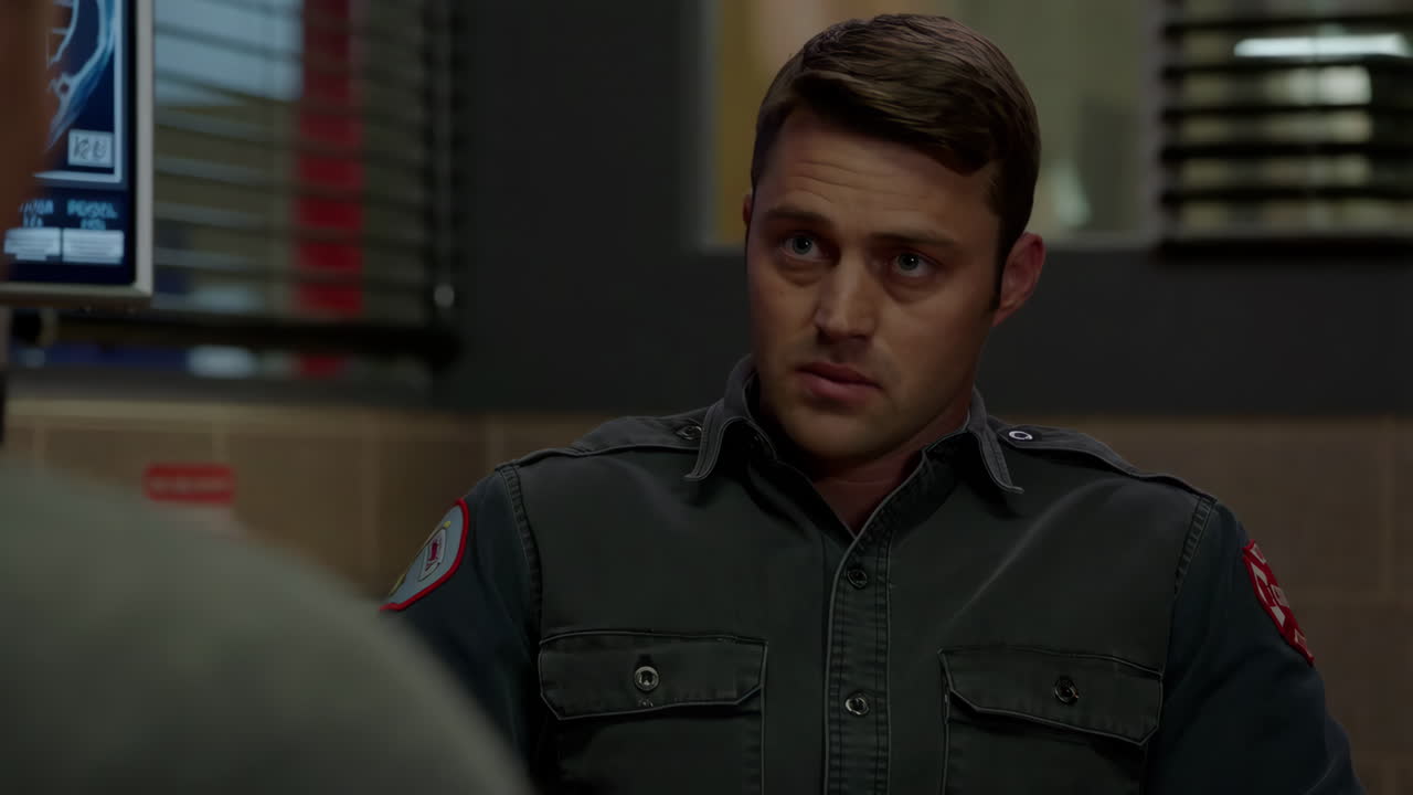 A man in a uniform from a TV show, possibly a firefighter