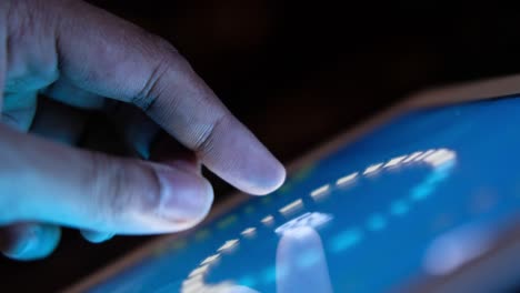 Hand touching a tablet screen