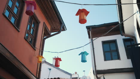 The-camera-moves-down-a-street-with-colorful-houses-with-bay-windows