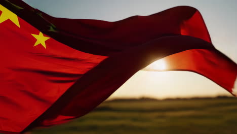 chinese flag waving in sunset