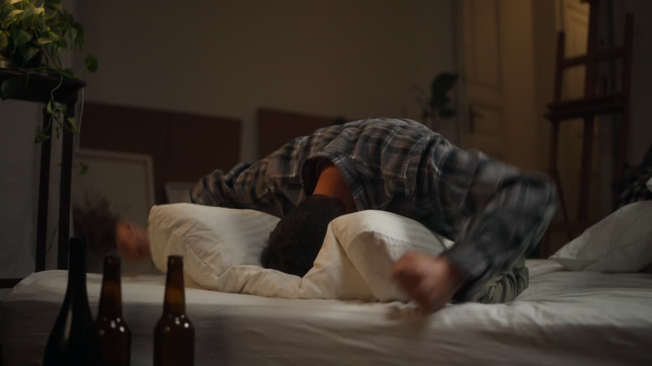 Man distressed in bed at night