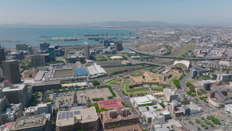 Castle-of-Good-Hope,-Grand-Parade-and-terminal-train-station-in-city.-Sea-bay-with-harbour-in-distance.-Cape-Town,-South-Africa